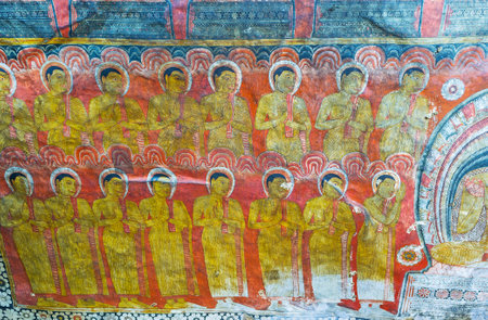 DAMBULLA, SRI LANKA - NOVEMBER 27, 2016: The walls and ceiling of Devaraja lena Cave (Divine King Cave or the Lord of the Gods Cave) of the Dambulla Viharaya decorated with frescoe, depicting life of Lord Buddha, on November 27 in Dambulla.のeditorial素材