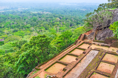 The foundations of the ancient buildings on the slope of the rock, on the way to Sigiriya Fortress, Sri Lanka.のeditorial素材