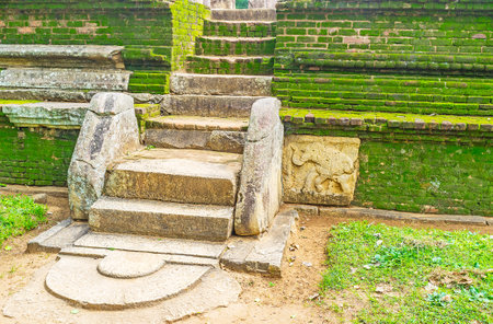 The ancient moonstone (sandakada pahana) at the stairs to the King's Council Chamber of the Nissanaka Malla Palace, Polonnaruwa, Sri Lanka.のeditorial素材