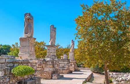 The view on row of marble sculptures, located in Ancient Agora of Athens, Greeceの写真素材