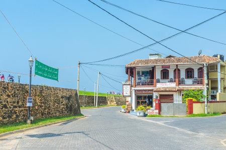 GALLE, SRI LANKA - DECEMBER 4, 2016: The walk along the medieval stone wall of the Old Dutch Fort, surrounding the town, Rampart street is the favorite tourist promenade, on December 4 in Galle.のeditorial素材
