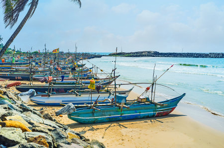 HIKKADUWA, SRI LANKA - DECEMBER 4, 2016: The Kumarakanda harbor, full of fishing canoes, going to the sea many times a day, on December 4 in Hikkaduwa.のeditorial素材