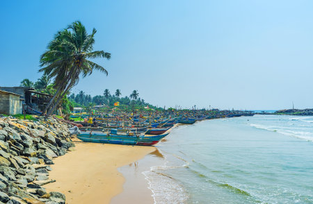 HIKKADUWA, SRI LANKA - DECEMBER 4, 2016: The Kumarakanda fishery harbor is the heart of resort and the famous place among tourists, on December 4 in Hikkaduwa.のeditorial素材