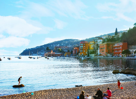 VILLEFRANCHE-SUR-MER, FRANCE - FEBRUARY 22, 2012: The sand beach next to the old town is the perfect...