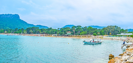 KEMER, TURKEY - MAY 5, 2017: Panorama of Moonlight beach, perfect place for swimming, relax on sun bed, fishing or take a boat trip, on May 5 in Kemer.の写真素材