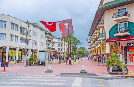 KEMER, TURKEY - MAY 5, 2017: The Munir Ozkul Liman shopping street decorated with Turkish flags and portraits of Ataturk, on May 5 in Kemer.のeditorial素材