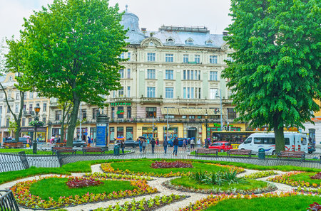 LVOV, UKRAINE - MAY 16, 2017: The park at Svobody avenue decorated with scenic flower beds, on May 16 in Lvov.のeditorial素材