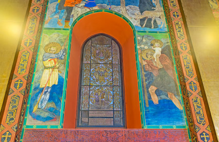 LVOV, UKRAINE - MAY 16, 2017: The stained glass window and frescoes of St George the Victorious and St Christopher carrying Christ Child in Armenian Cathedral were created by Jan Henryk Rosen, on May 16 in Lvov.のeditorial素材
