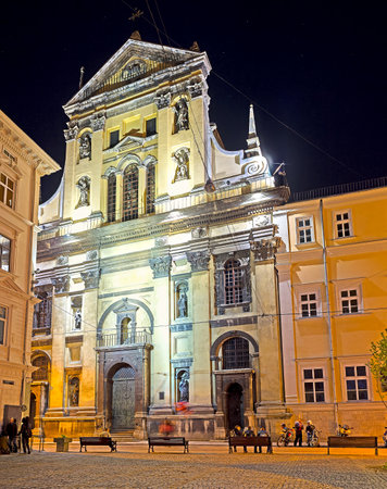LVOV, UKRAINE - MAY 16, 2017: The evening view of St Peter and Paul Garrison Church, decorated with sculptures and reliefs, on May 16 in Lvov.のeditorial素材