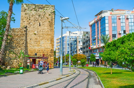 ANTALYA, TURKEY - MAY 6, 2017: The ruins of the ancient ramparts neighbor with the modern buildings in Cumhuriyet avenue, on May 6 in Antalya.のeditorial素材