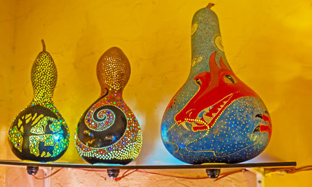ANTALYA, TURKEY - MAY 6, 2017: The Eastern lamps and shades of dried pumpkin shells in stall of Old Bazaar decorated with colorful dragons, floral and animalistic motives, on May 6 in Antalya.のeditorial素材