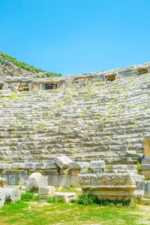 The ruins of decoration nawadays lies on the ground of amphitheater, Myra, Turkeyの写真素材