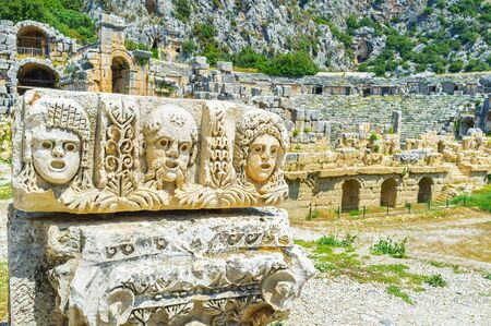 The stone masks on the ruined building element, on Myra, Turkey.の写真素材