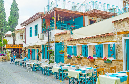 ANTALYA, TURKEY - MAY 6, 2017: The scenic cafes and luxury restaurants of Kaleici help to enjoy the atmosphere of resort and relax during vacation, on May 6 in Antalya.のeditorial素材