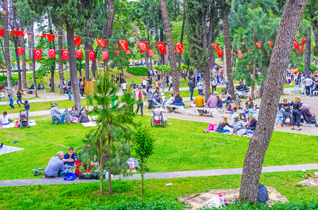 ANTALYA, TURKEY - MAY 6, 2017: The shady lawn of Karaalioglu Park is the favorite place for family picnics, people come here on weekends, festivals, or public celebrations, on May 6 in Antalya.の写真素材