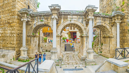 ANTALYA, TURKEY - MAY 6, 2017: Three arches of Hadrian's Gate, decorated with carved Roman patterns...