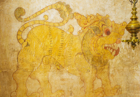 UDUNUWARA, SRI LANKA - NOVEMBER 29, 2016: The ancient fresco in the image house of Lankathilaka Vihara Temple, depicting the roaring lion, on November 29 in Udunuwara.のeditorial素材
