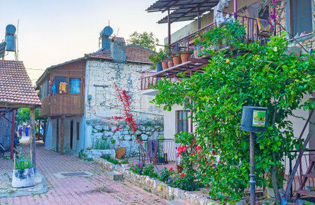 KEKOVA, TURKEY - MAY 7, 2017: The old houses with balconies of small fishing village,  on May 7 in Kekova.のeditorial素材