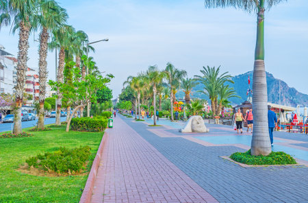 ALANYA, TURKEY - MAY 8, 2017: The picturesque seaside promenade decorated with lush greenery, modern sculptures and boasts many street cafes, on May 8 in Turkey.のeditorial素材