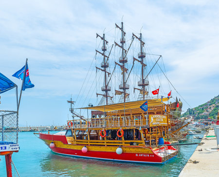 ALANYA, TURKEY - MAY 9, 2017: The pleasure boats in old port offer different trips to the tourist, visiting resort, on May 9 in Alanya, Turkey.のeditorial素材
