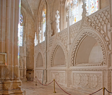 BATALHA, PORTUGAL - APRIL 30, 2012: The niches with princes' tombs in Founders' Chapel of St Mary of Victory Convent decorated with carved coats of arms and complex patterns, on April 30 in Batalha.のeditorial素材