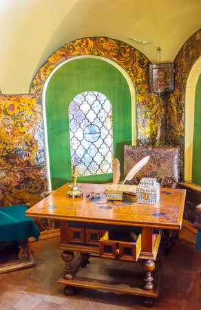 MOSCOW, RUSSIA - MAY 11, 2015: The Cabinet of the Palace of Romanov Boyar with painted walls and carved wooden furniture, on May 11 in Moscowのeditorial素材