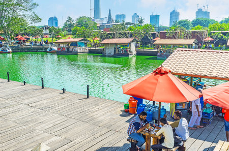COLOMBO, SRI LANKA - DECEMBER 7, 2016:  The hot midday in Pettah Floating Market on the bank of Beira lake is time to relax in local cafe or take a boat trip, on December 7 in Colombo.のeditorial素材
