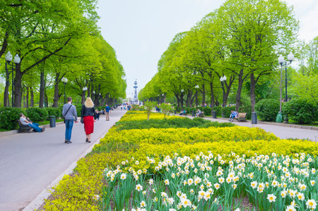MOSCOW, RUSSIA - MAY 11, 2015: The alley in Gorky Park with beautiful flower beds is one of the most popular place among couples, on May 11 in Moscow, Russiaのeditorial素材
