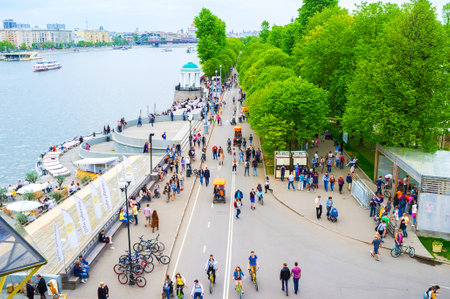 MOSCOW, RUSSIA - MAY 11, 2015: The pedestrian Pushkin embankment is the best place for bicycle riding, skating, or just walking along river, on May 11 in Moscow, Russiaのeditorial素材