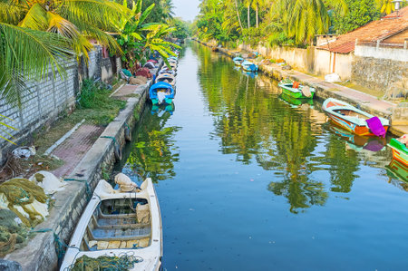 The bridges over Hamilton's Canal in Negombo are the nice places to enjoy the views of fishing village, moored boats and lush gardens along the banks, Sri Lanka.のeditorial素材