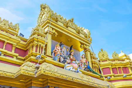 The scultures of Hindu deities above the gate to the Sri Muthu Vinayakar Swamy Kovil in Sea street of Pettah district, Colombo, Sri Lanka.のeditorial素材