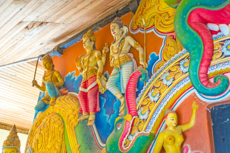 OKKAMPITIYA, SRI LANKA - DECEMBER 2, 2016: The Makara Thorana Arch in Dematamal Temple boasts beautiful colorful sculptures of guardians, on December 2 in Okkampitiyaのeditorial素材