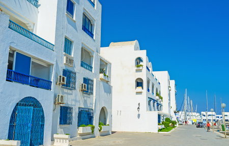 MONASTIR, TUNISIA - AUGUST 29, 2015: Marina is the popular tourist neighborhood with modern cottages in Arabic style, numerous yachts, cafes and hotels, on August 29 in Monastir, Tunisia.のeditorial素材
