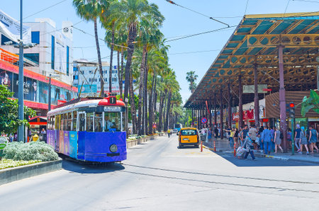 ANTALYA, TURKEY - MAY 12, 2017: The corner of busy Cumhuriyet Avenue and Ataturk Boulevard with regular heavy traffic, many people and high trade activity make this place noisy and crowded, on May 12 in Antalya.のeditorial素材