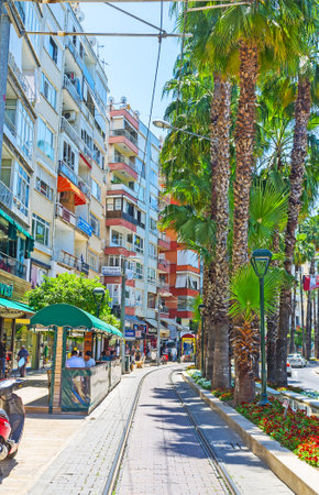 ANTALYA, TURKEY - MAY 13, 2017: The tram line runs along the Ataturk Boulevard, famous tourist location with large amount of popular stores and interesting cafes, on May 13 in Antalya.のeditorial素材