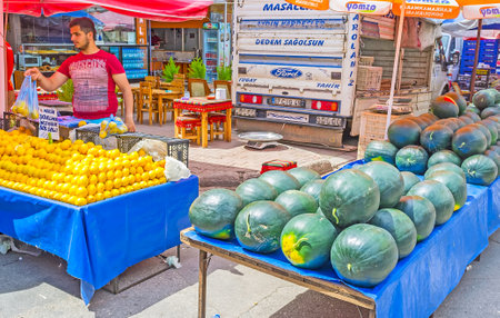 ANTALYA, TURKEY - MAY 12, 2017: The fruit stall with large heap of lemons and watermelons in Friday market in Muratpasa neighborhood, on May 12 in Antalya.のeditorial素材