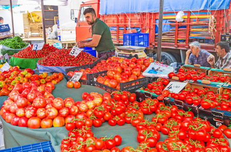 ANTALYA, TURKEY - MAY 12, 2017: The vegetable stall of Friday market in Muratpasa neighborhood specializes in different sorts of fragrant juicy tomatoes, on May 12 in Antalya.のeditorial素材
