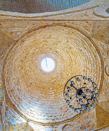 ANTALYA, TURKEY - MAY 12, 2017: The medieval stone dome of Seljuk Alaaddin Mosque, also known as Yivliminare or Ulu Cami (Grand Mosque), the hole in center provides daylight to the hall, on May 12 in Antalya.のeditorial素材
