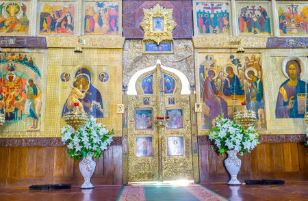 POCHAYIV, UKRAINE - AUGUST 30, 2017: The golden Royal doors in iconostasys of Holy Trinity Cathedral, on August 30 in Pochayiv.のeditorial素材
