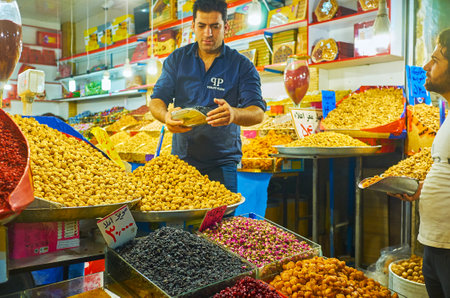 TEHRAN, IRAN - OCTOBER 11, 2017: The stall of dry fruits, nuts, sweets, candies and rose flowers in Grand Bazaar, on October 11 in Tehran.のeditorial素材