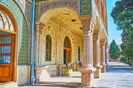 TEHRAN, IRAN - OCTOBER 11, 2017: The  porch of the main entrance to Golestan Palace with stone columns, sculptures of lions, tiled and brick patterns, on October 11 in Tehran.のeditorial素材