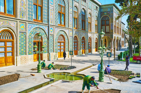 TEHRAN, IRAN - OCTOBER 11, 2017: The gardeners plant flower beds in Golestan gardens, next to the medieval palace, on October 11 in Tehran.のeditorial素材