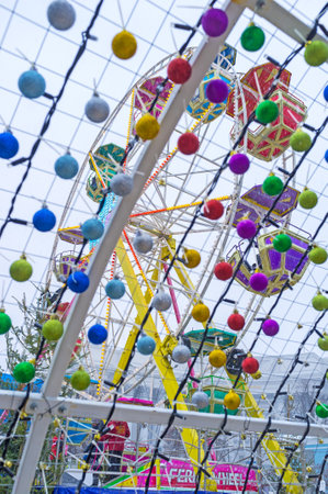 KIEV, UKRAINE - JANUARY 4, 2017: The view on Ferris Wheel through christmas decoration of arch of wishes, on January 4 in Kiev.のeditorial素材