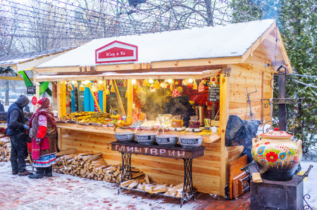 KIEV, UKRAINE - JANUARY 4, 2017: Christmas festival is the best place to eat traditional ukrainian street food with hot alcohol beverages, on January 4 in Kiev.のeditorial素材