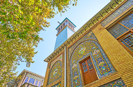 The wind tower of Emarat-e Badgir (Windcatchers Building) of Golestan is decorated with bright blue tiled patterns, Tehran, Iran.のeditorial素材