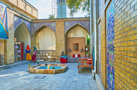 TEHRAN, IRAN - OCTOBER 11, 2017: The courtyard of Emarat-e Badgir (Wind Towers Building) of Golestan palace houses the photo studio with traditional furniture and historic costumes, on October 11 in Tehran.のeditorial素材