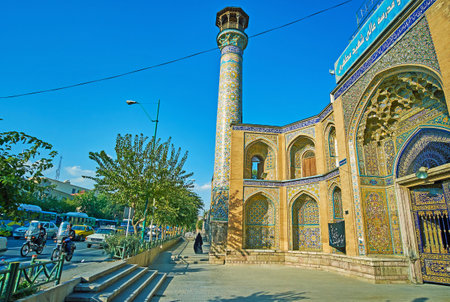TEHRAN, IRAN - OCTOBER 11, 2017: The walk along the Mostafa Khomeini street with the view on tall minaret and old building of Shahid Motahari (Sepahsalar) mosque, on October 11 in Tehran.のeditorial素材
