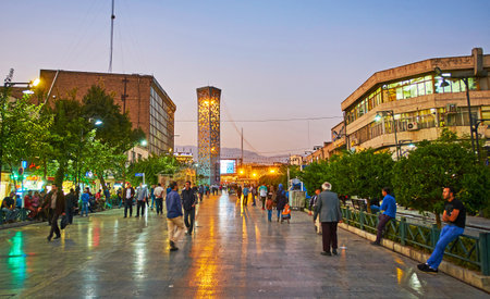 TEHRAN, IRAN - OCTOBER 11, 2017: The shopping street adjacent to Imam Hossein Square is decorated with green trees, making it nice place to rest, on October 11 in Tehran.のeditorial素材