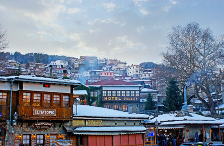 METSOVO, GREECE - JANUARY 2, 2012: The walk in market area of the mountain resort with a view on the housing on the slope of the hill, on January 2 in Metsovo.のeditorial素材