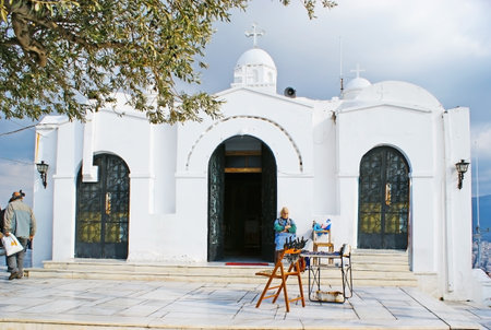 ATHENS, GREECE - December 31, 2011: The white Chapel of St George on the top of the Mount Lycabettus is one of the city landmarks, on December 31 in Athens.のeditorial素材